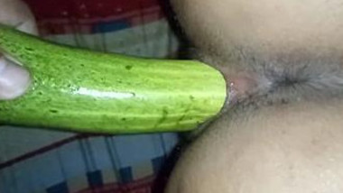 Indian guy during sex in bedroom penetrates GF's pussy with XXX cucumber