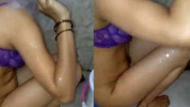 Indian hides XXX tits under her purple bra and washes body on camera